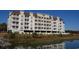 Spacious condo building with private balconies, parking garage, and beautiful pond view at 502 48Th Ave. S # 402, North Myrtle Beach, SC 29582