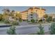Inviting condo building with manicured landscaping and convenient covered parking at 502 48Th Ave. S # 402, North Myrtle Beach, SC 29582