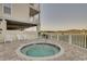 Exterior hot tub area features a jacuzzi, white lounge chairs, and partial fencing at 502 48Th Ave. S # 402, North Myrtle Beach, SC 29582