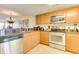 Modern kitchen featuring stainless steel appliances, granite countertops, and wood cabinetry, with adjacent breakfast bar at 502 48Th Ave. S # 402, North Myrtle Beach, SC 29582