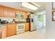 Well-equipped kitchen with stainless steel appliances, ample counter space, and wood cabinets for storage and food preparation at 502 48Th Ave. S # 402, North Myrtle Beach, SC 29582