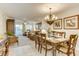 Bright living room with neutral tones, dining area, and balcony access, offering a comfortable and inviting living space at 502 48Th Ave. S # 402, North Myrtle Beach, SC 29582