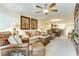 Comfortable living room with ceiling fan and neutral decor, flowing into dining area at 502 48Th Ave. S # 402, North Myrtle Beach, SC 29582