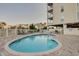 Outdoor pool area features a pool, chaise lounges, tables, and a view of the surrounding area at 502 48Th Ave. S # 402, North Myrtle Beach, SC 29582