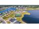 Aerial community view features a pool, tennis courts, playground, parking, and a view of the lake at 537 Indigo Bay Circle, Myrtle Beach, SC 29579
