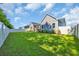 A spacious, well-maintained backyard features lush green grass, a privacy fence, and exterior of a home at 537 Indigo Bay Circle, Myrtle Beach, SC 29579