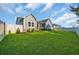 A spacious, well-maintained backyard features lush green grass, a privacy fence, and exterior of a home at 537 Indigo Bay Circle, Myrtle Beach, SC 29579