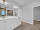 Bathroom featuring double vanity, large mirror, tile floors, and glass-enclosed shower at 537 Indigo Bay Circle, Myrtle Beach, SC 29579