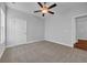 Neutral bedroom showcasing plush carpet and ceiling fan, offering a calming and comfortable atmosphere at 537 Indigo Bay Circle, Myrtle Beach, SC 29579
