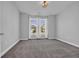 Well-lit bedroom featuring carpeted floors and double windows, creating an inviting space at 537 Indigo Bay Circle, Myrtle Beach, SC 29579