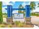 Community entrance sign for Indigo Bay, featuring brick pillars, blue columns, and beautiful landscaping at 537 Indigo Bay Circle, Myrtle Beach, SC 29579