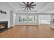 Spacious living room with tray ceilings, fireplace, hardwood floors, and plenty of natural light at 537 Indigo Bay Circle, Myrtle Beach, SC 29579