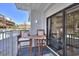 Relaxing balcony with seating, offering views of the neighborhood and natural light at 5511 North Ocean Blvd. # 105, Myrtle Beach, SC 29577