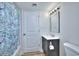 Well lit bathroom with a shower/tub combination, stylish vanity, and wood look flooring at 5511 North Ocean Blvd. # 105, Myrtle Beach, SC 29577