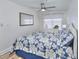 Comfortable bedroom features a large window with wood-look flooring and a neutral color palette at 5511 North Ocean Blvd. # 105, Myrtle Beach, SC 29577