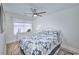 Bright bedroom with a decorative blue and white comforter, light walls and wood-look floors at 5511 North Ocean Blvd. # 105, Myrtle Beach, SC 29577