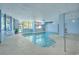 Bright indoor pool and spa featuring plenty of lounging space with ample sunlight at 5511 North Ocean Blvd. # 105, Myrtle Beach, SC 29577