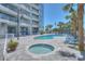 Enjoy the sunshine at the pool area with palm trees, a hot tub, and plenty of lounge chairs at 5511 North Ocean Blvd. # 105, Myrtle Beach, SC 29577