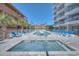 Enjoy a luxury pool and spa featuring plenty of room to lounge and palm trees at 5511 North Ocean Blvd. # 105, Myrtle Beach, SC 29577