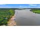 A scenic aerial view showcasing a river with waterfront homes at 56 Henderson Way, Pawleys Island, SC 29585