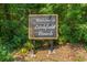 A welcoming sign to Litchfield Beach surrounded by lush greenery and foliage at 56 Henderson Way, Pawleys Island, SC 29585
