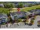 Aerial shot of condos near a golf course; a serene and picturesque community perfect for relaxation and recreation at 5751 Oyster Catcher Dr. # 431, North Myrtle Beach, SC 29582