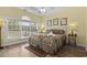 Bright bedroom featuring a ceiling fan, neutral paint, wood floors and a large window with a view at 5751 Oyster Catcher Dr. # 431, North Myrtle Beach, SC 29582