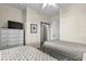Bedroom with twin beds, dresser with a TV, and light walls at 5751 Oyster Catcher Dr. # 431, North Myrtle Beach, SC 29582