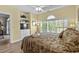 Bedroom with light-yellow walls, wood-look floors, a ceiling fan, and built-in shelving and cabinets at 5751 Oyster Catcher Dr. # 431, North Myrtle Beach, SC 29582