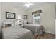 Bedroom featuring two twin beds with white headboards, and a window with a tropical print valance at 5751 Oyster Catcher Dr. # 431, North Myrtle Beach, SC 29582