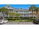 Attractive three-story condo featuring classic architecture, private balconies, and lush landscaping at 5751 Oyster Catcher Dr. # 431, North Myrtle Beach, SC 29582