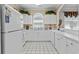 Bright eat-in kitchen with white cabinetry, appliances, and a window overlooking the sink at 5751 Oyster Catcher Dr. # 431, North Myrtle Beach, SC 29582