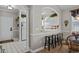 Well-lit kitchen boasts white cabinetry, a breakfast bar with seating, and modern finishes at 5751 Oyster Catcher Dr. # 431, North Myrtle Beach, SC 29582