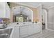 Updated kitchen with white cabinetry and a view into the vaulted ceiling living room at 5751 Oyster Catcher Dr. # 431, North Myrtle Beach, SC 29582