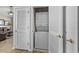 Laundry area featuring a stacked washer and dryer behind louvered doors at 5751 Oyster Catcher Dr. # 431, North Myrtle Beach, SC 29582