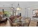 Inviting living area with an open layout, stylish dining set, and comfortable seating; perfect for entertaining at 5751 Oyster Catcher Dr. # 431, North Myrtle Beach, SC 29582