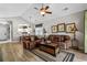 Bright living room featuring vaulted ceilings, comfortable seating, and seamless flow into the dining area at 5751 Oyster Catcher Dr. # 431, North Myrtle Beach, SC 29582