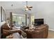 Cozy living room showcasing vaulted ceilings, comfortable seating, and natural light through patio doors at 5751 Oyster Catcher Dr. # 431, North Myrtle Beach, SC 29582