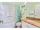Fresh bathroom features a shower-tub combo, granite countertop, and decorative ocean-themed accents at 6001 N Ocean Blvd. # 147, North Myrtle Beach, SC 29582