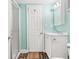 Bathroom featuring shower, vinyl floors, a white vanity, and light green walls at 6001-1592 South Kings Hwy., Myrtle Beach, SC 29575