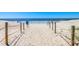 Scenic beach access via a sandy path marked with rope fences, leading to the ocean at 6001-1592 South Kings Hwy., Myrtle Beach, SC 29575