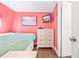 Bedroom with a bed, wicker drawers, and artwork on the walls at 6001-1592 South Kings Hwy., Myrtle Beach, SC 29575