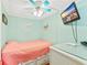 Light and airy bedroom with light green walls, ceiling fan, and TV at 6001-1592 South Kings Hwy., Myrtle Beach, SC 29575