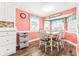 Cozy dining area with table, chairs, and white cabinetry, offering a functional space at 6001-1592 South Kings Hwy., Myrtle Beach, SC 29575