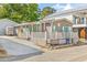 Inviting home with a covered porch and white railing, ideal for relaxing outdoors at 6001-1592 South Kings Hwy., Myrtle Beach, SC 29575
