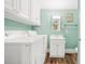 The laundry room offers overhead cabinet storage at 6001-1592 South Kings Hwy., Myrtle Beach, SC 29575