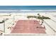 Aerial view of a basketball court located on a sandy beach with ocean views and palm tree landscaping at 6001-5117 S Kings Hwy., Myrtle Beach, SC 29575