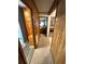 Hallway leading to bedrooms features wood paneling and neutral carpet at 6001-5117 S Kings Hwy., Myrtle Beach, SC 29575