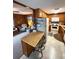 Cozy open kitchen with adjacent living space and wood accents throughout at 6001-5117 S Kings Hwy., Myrtle Beach, SC 29575
