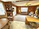 Inviting living room with wood paneling, comfortable seating and ample light at 6001-5117 S Kings Hwy., Myrtle Beach, SC 29575
